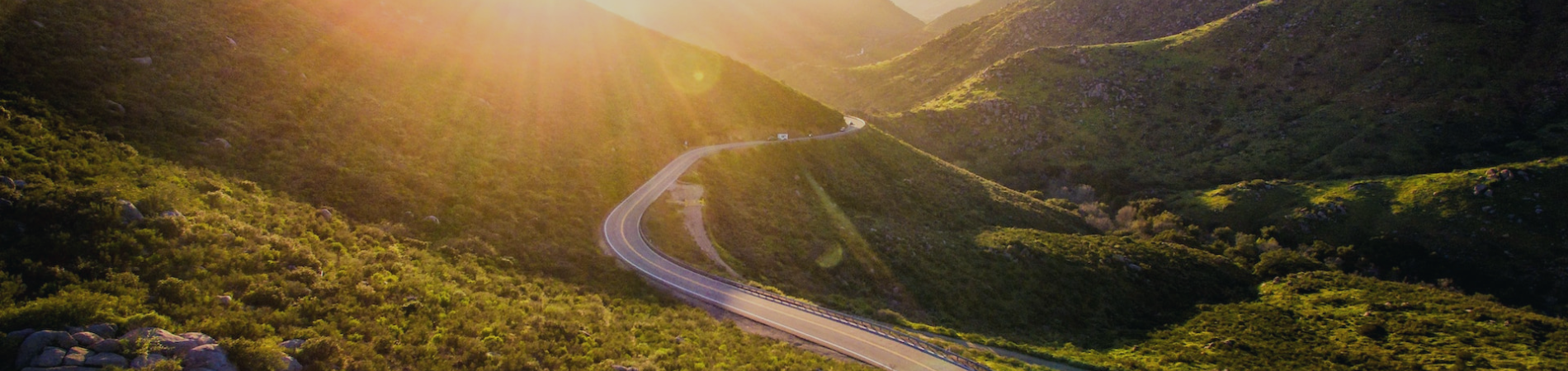 A windy road through a mountain region.