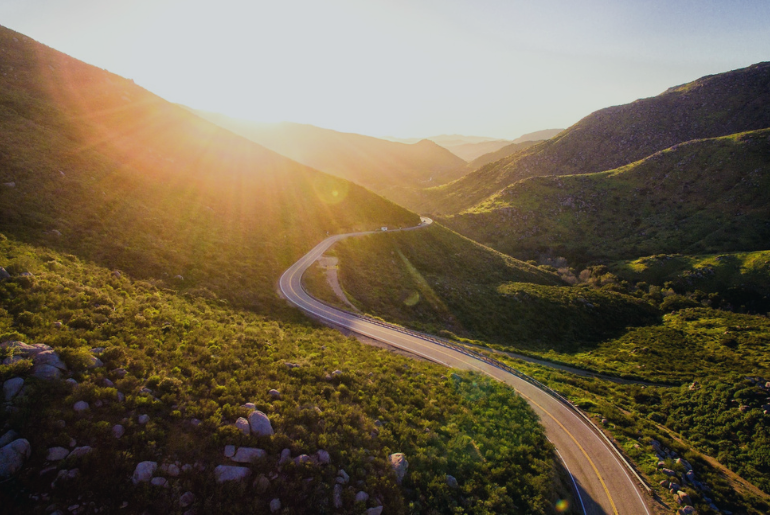 A windy road through a mountain region.
