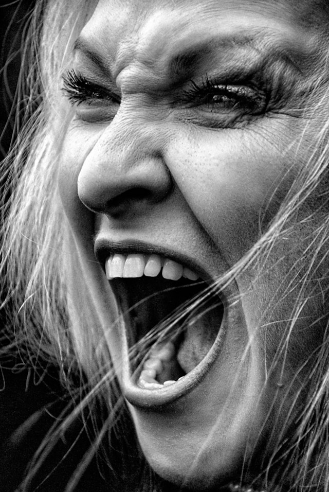 A woman screaming in frustration
